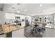 Bright kitchen features stainless steel appliances, granite countertops, and a dining table at 3419 W Empedrado St, Tampa, FL 33629