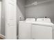 Functional laundry room equipped with a modern washer and dryer at 3419 W Empedrado St, Tampa, FL 33629