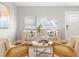 Bright living room features modern furniture, neutral tones, and lots of natural light at 3419 W Empedrado St, Tampa, FL 33629