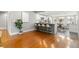 Spacious open floorplan with hardwood floors and a modern kitchen featuring a breakfast bar at 3419 W Empedrado St, Tampa, FL 33629