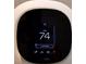 Close up of a smart thermostat showing the current temperature and settings at 3419 W Empedrado St, Tampa, FL 33629