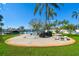 Circular backyard patio featuring dining furniture, a grill, and views of the canal at 3717 46Th S Ave # 7, St Petersburg, FL 33711