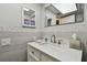 Modern bathroom featuring a skylight, vanity with ample counter space and updated fixtures at 3717 46Th S Ave # 7, St Petersburg, FL 33711