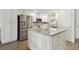 Beautiful kitchen featuring an island with granite countertop and modern stainless steel appliances at 3717 46Th S Ave # 7, St Petersburg, FL 33711