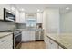 Stylish kitchen with stainless steel appliances, granite countertops, and a view of the sink and microwave at 3717 46Th S Ave # 7, St Petersburg, FL 33711