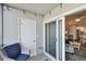 Cozy enclosed patio featuring a comfortable chair and slider access to the interior at 3717 46Th S Ave # 7, St Petersburg, FL 33711