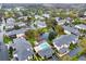 This aerial view features a complex with a pool and lush landscaping surrounding the waterway at 4524 Southampton Ct # 4524, Tampa, FL 33618