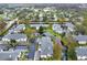 An aerial view shows the neighborhood includes a well-maintained landscape and pond at 4524 Southampton Ct # 4524, Tampa, FL 33618