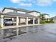 Exterior shot of the carports of the townhouses with a blue car parked in the carport at 4524 Southampton Ct # 4524, Tampa, FL 33618