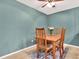 Inviting dining area with wood table, chairs, and stylish gray accent wall at 4524 Southampton Ct # 4524, Tampa, FL 33618