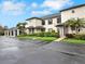 Charming townhouses feature covered carports, manicured lawns, and beautiful landscaping at 4524 Southampton Ct # 4524, Tampa, FL 33618