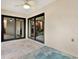 Cozy screened lanai featuring tile floors and multiple sliding glass doors at 4524 Southampton Ct # 4524, Tampa, FL 33618