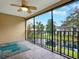 Screened lanai boasting a ceiling fan and a view of a pond at 4524 Southampton Ct # 4524, Tampa, FL 33618