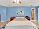 Comfortable main bedroom with blue walls and ensuite bathroom at 4524 Southampton Ct # 4524, Tampa, FL 33618