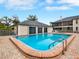 Community pool area featuring a pool, spa, and surrounding clubhouse at 4524 Southampton Ct # 4524, Tampa, FL 33618