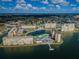 Aerial view of the condo buildings surrounded by water and lush landscaping at 4525 Cove Cir # 705, St Petersburg, FL 33708