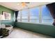 Bright bedroom with tile floors, tropical chair, and a coastal view at 4525 Cove Cir # 705, St Petersburg, FL 33708