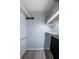 This closet features built-in wire shelving and laminate floors at 4525 Cove Cir # 705, St Petersburg, FL 33708