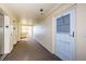 Well-lit hallway with access to elevators and residential units at 4525 Cove Cir # 705, St Petersburg, FL 33708