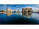 Scenic view of Sea Towers community buildings reflected on the calm, deep blue waters of the surrounding area at 4525 Cove Cir # 705, St Petersburg, FL 33708