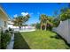 Picture of the backyard with a pool, lush grass, and well-maintained landscaping at 4568 40Th S St, St Petersburg, FL 33711