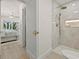 Modern bathroom showing a glass-enclosed shower with gold fixtures and tiled walls at 4568 40Th S St, St Petersburg, FL 33711