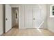 Unfurnished bedroom with light wooden floors, double closets, and a window at 4568 40Th S St, St Petersburg, FL 33711