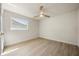 Bright bedroom featuring light hardwood floors, fresh paint, and a ceiling fan at 4568 40Th S St, St Petersburg, FL 33711