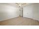 Bedroom features wood-look flooring, ceiling fan and closet with double doors at 4568 40Th S St, St Petersburg, FL 33711