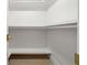 Simple, unfurnished closet with white shelving and wooden floors at 4568 40Th S St, St Petersburg, FL 33711