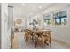 Bright dining room boasting wood table, seating for six, and natural light at 4568 40Th S St, St Petersburg, FL 33711