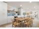 Dining room features wood table, seating for six, flowing into the open floor plan at 4568 40Th S St, St Petersburg, FL 33711