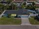 Aerial view of the home with a well-manicured lawn and a two-car garage at 4568 40Th S St, St Petersburg, FL 33711
