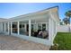 Angle shot of the exterior featuring the patio with multiple seating areas at 4568 40Th S St, St Petersburg, FL 33711