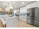 Modern kitchen boasts marble island, stainless steel appliances, and ample storage at 4568 40Th S St, St Petersburg, FL 33711