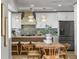Modern kitchen with stainless steel appliances, island seating, and stylish lighting fixtures at 4568 40Th S St, St Petersburg, FL 33711