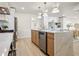Open concept kitchen with a large island, stainless steel appliances, and light wood flooring at 4568 40Th S St, St Petersburg, FL 33711