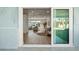 Bright living room with wood floors, modern furniture, and sliding glass doors to the outdoor pool area at 4568 40Th S St, St Petersburg, FL 33711