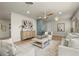 Comfortable living room with ceiling fan, neutral furniture, and decorative accents at 4568 40Th S St, St Petersburg, FL 33711