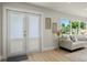 A well-decorated living room with large windows and hardwood floors at 4568 40Th S St, St Petersburg, FL 33711