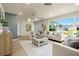 Inviting living room with large windows, neutral furniture, and ample natural light at 4568 40Th S St, St Petersburg, FL 33711