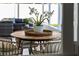 Cozy outdoor dining area on the patio, framed by views of the living area and swimming pool beyond at 4568 40Th S St, St Petersburg, FL 33711
