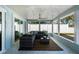 Spacious patio with ceiling fan and comfortable seating, perfect for outdoor relaxation and entertainment at 4568 40Th S St, St Petersburg, FL 33711