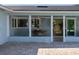 Wide view of the patio with multiple seating and dining areas, with access to both the backyard and interior spaces at 4568 40Th S St, St Petersburg, FL 33711