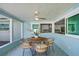 Charming patio with dining set, providing a view to the kitchen and a lovely outdoor dining experience at 4568 40Th S St, St Petersburg, FL 33711