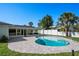 Inviting pool with brick patio and a covered lounge area for outdoor relaxation at 4568 40Th S St, St Petersburg, FL 33711