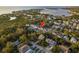 Aerial view of a neighborhood with stunning water views and mature landscaping at 476 Rebstock Blvd, Palm Harbor, FL 34683