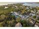 Beautiful neighborhood aerial view showcasing luxurious homes nestled among trees with waterfront access at 476 Rebstock Blvd, Palm Harbor, FL 34683