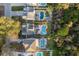 An aerial shot highlighting multiple homes with backyard pools and well-maintained landscaping at 476 Rebstock Blvd, Palm Harbor, FL 34683