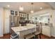 Bright kitchen with stainless steel appliances, marble countertops, white cabinets and eat in island at 476 Rebstock Blvd, Palm Harbor, FL 34683